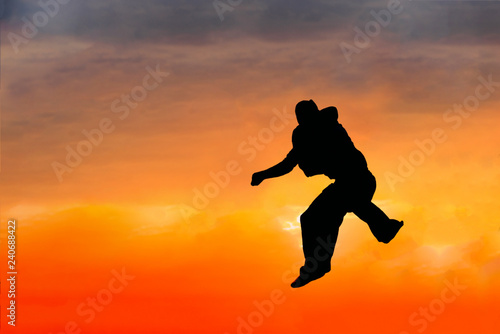 Young man performs parkour outdoor