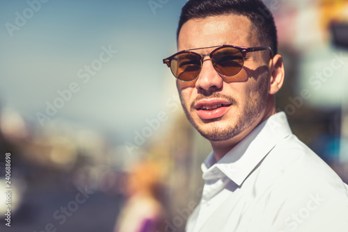 Handsome urban lawyer wearing sunglasses at urbal place © qunica.com