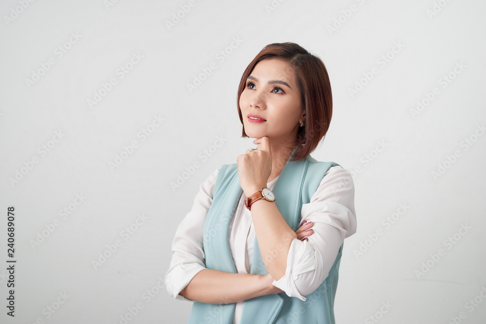 Young beautiful business woman hands on chin, thinking making choice, isolated on white Young beautiful business woman hands on chin, thinking making choice, isolated on white