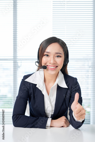 Call center operators. Young beautiful business woman in headset