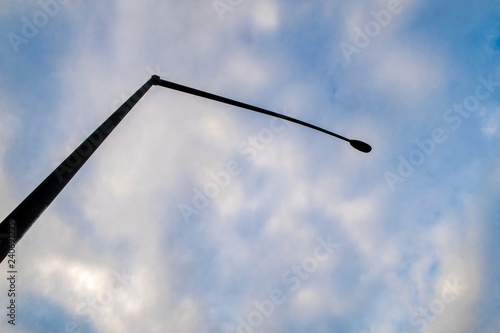 street lamp on blue cloudy sky