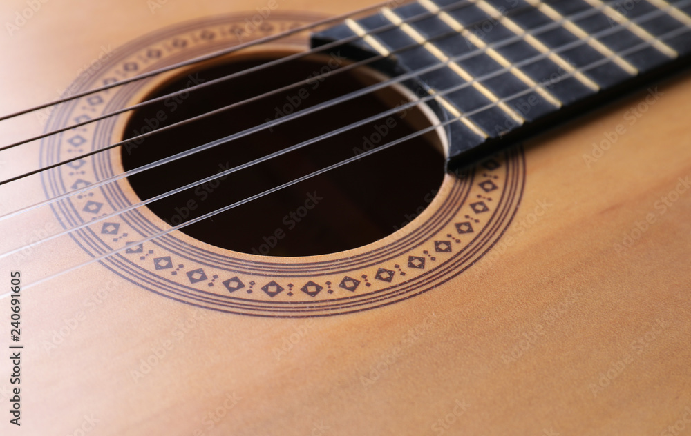 Closeup view of acoustic guitar, focus on sound hole Closeup view of acoustic guitar, focus on sound hole