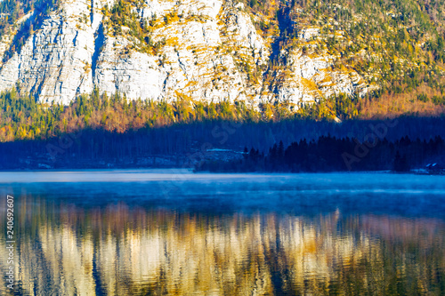 The lake is surrounded by beautiful mountains, mountains, pines, trees, spring, fog over the water
