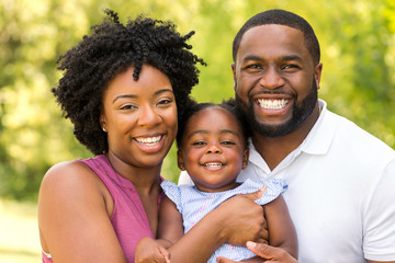 Happy African American family laughing and smiling.