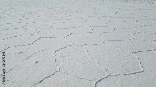 Walking through the Uyuni Salar in Bolivia. Close up on the hexagon salt flats. Uyuni, Potosi Bolivia.
