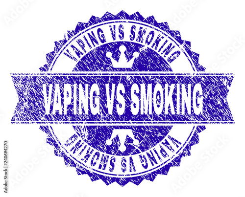 VAPING VS SMOKING rosette stamp seal imprint with grunge style. Designed with round rosette, ribbon and small crowns. Blue vector rubber watermark of VAPING VS SMOKING caption with grunge style.