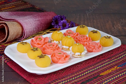 Thai auspicious food / Royal Thai cuisine : Five mixed Thai Golden sweetmeat (Sa Ne Jan, DaraThong, Thong Chompoo Nuch, Thong Ek and Thong Nopphakhun) , Famous Thai auspicious desserts. Copy space. photo