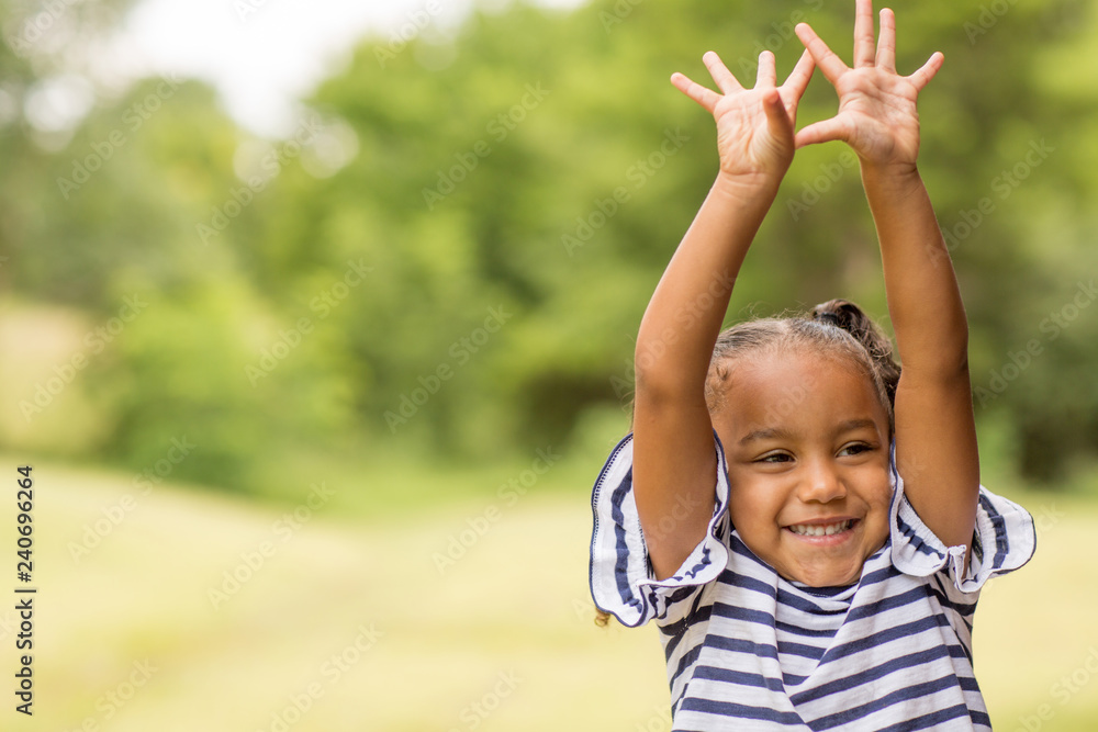 Cute mixed race little girl laughing and smiling. Cute mixed race little girl laughing and smiling.