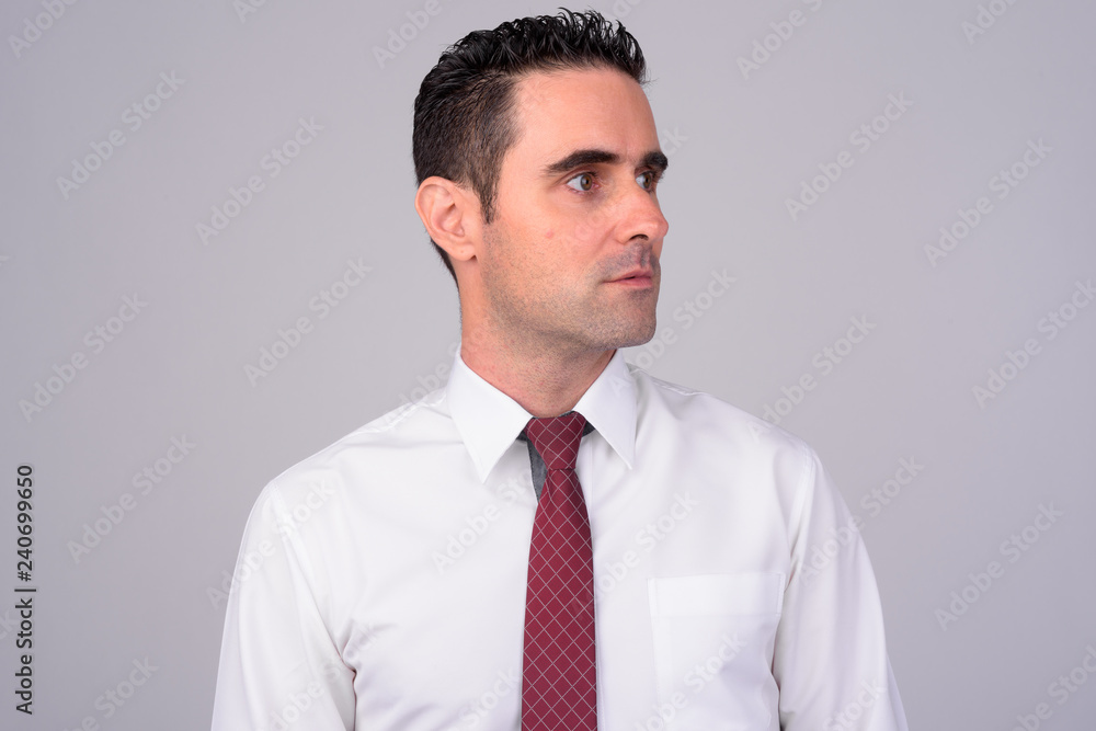 Face of handsome businessman against white background Face of handsome businessman against white background
