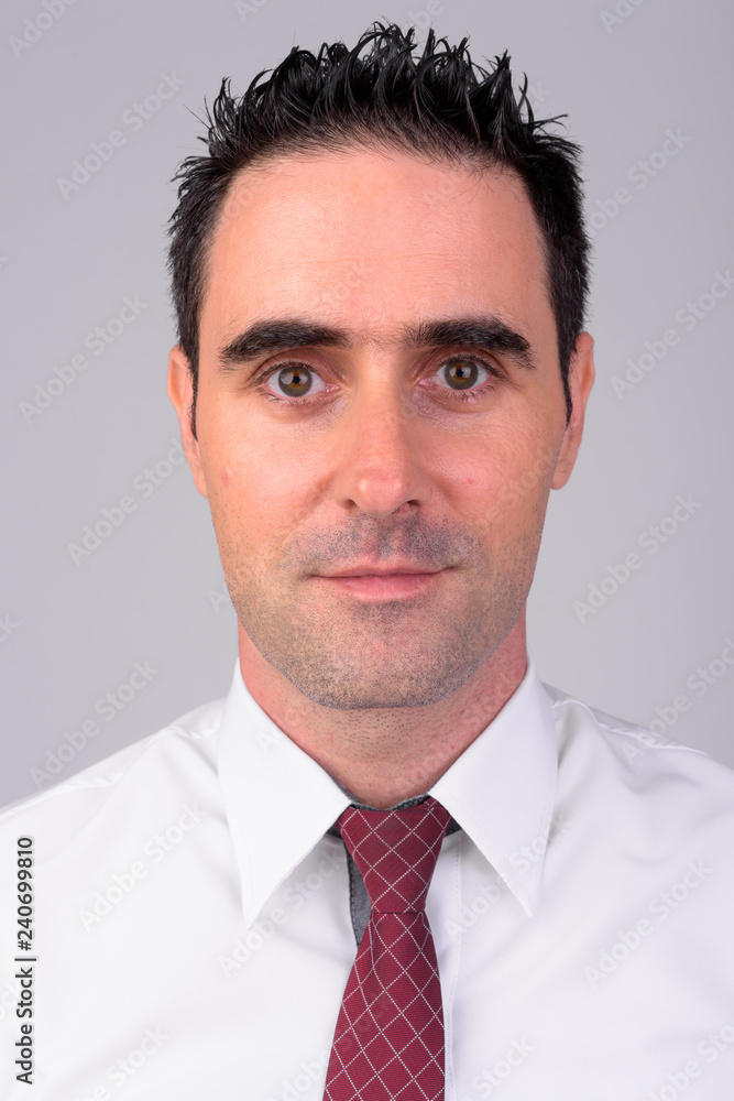 Face of handsome businessman against white background Face of handsome businessman against white background