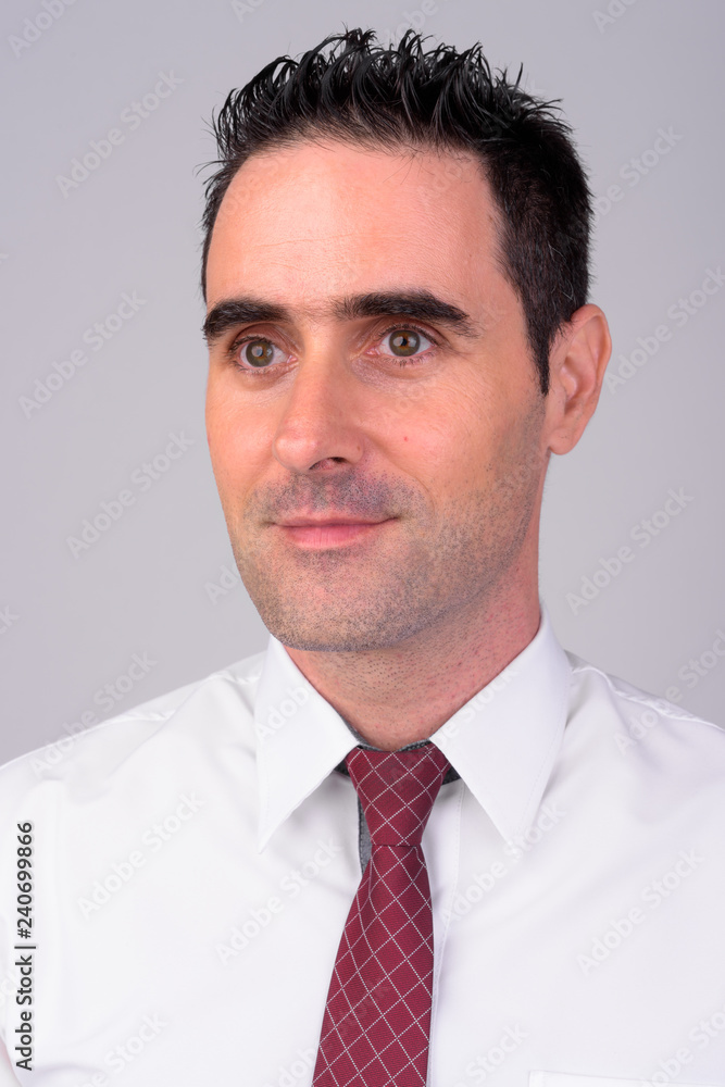 Face of handsome businessman against white background Face of handsome businessman against white background