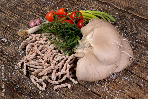 Busiate raw Tumminia variety with pleurotus mushrooms   photo