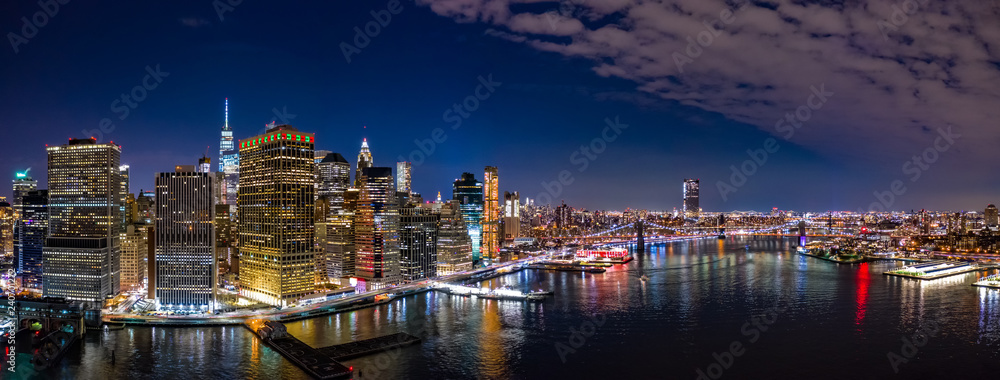 Aerial panorama of the Lower Manhattan and Brooklyn Bridge by night