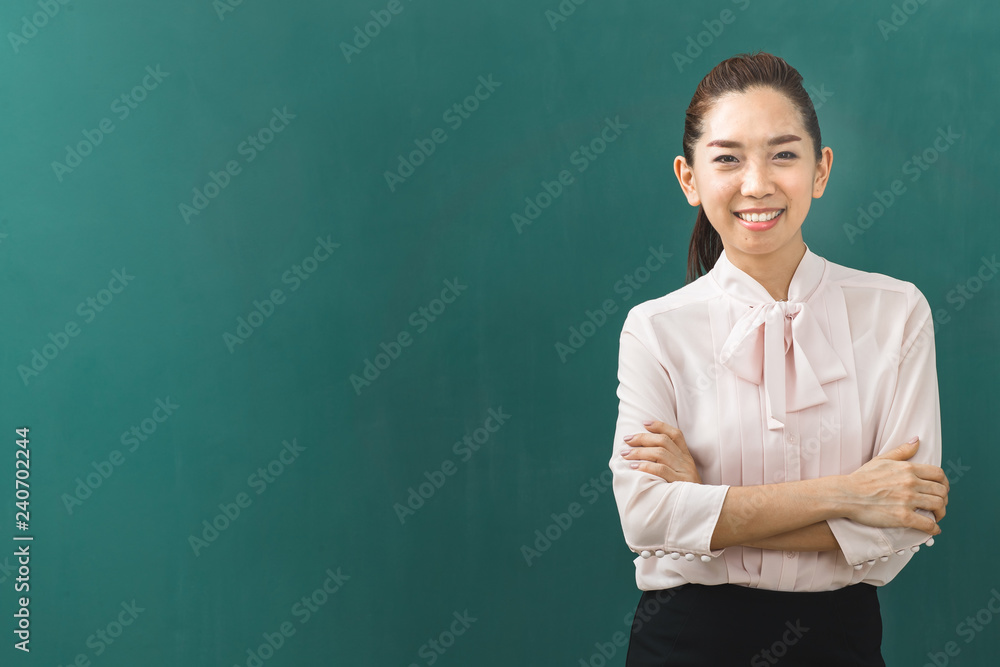 Asian teacher poses for photograph. Asian teacher poses for photograph.