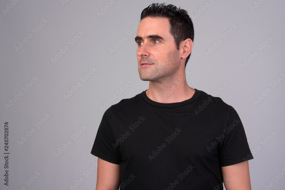 Fototapeta premium Portrait of handsome man against white background