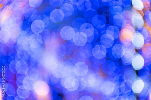 Festival or carnival abstract background with bokeh defocused lights and stars