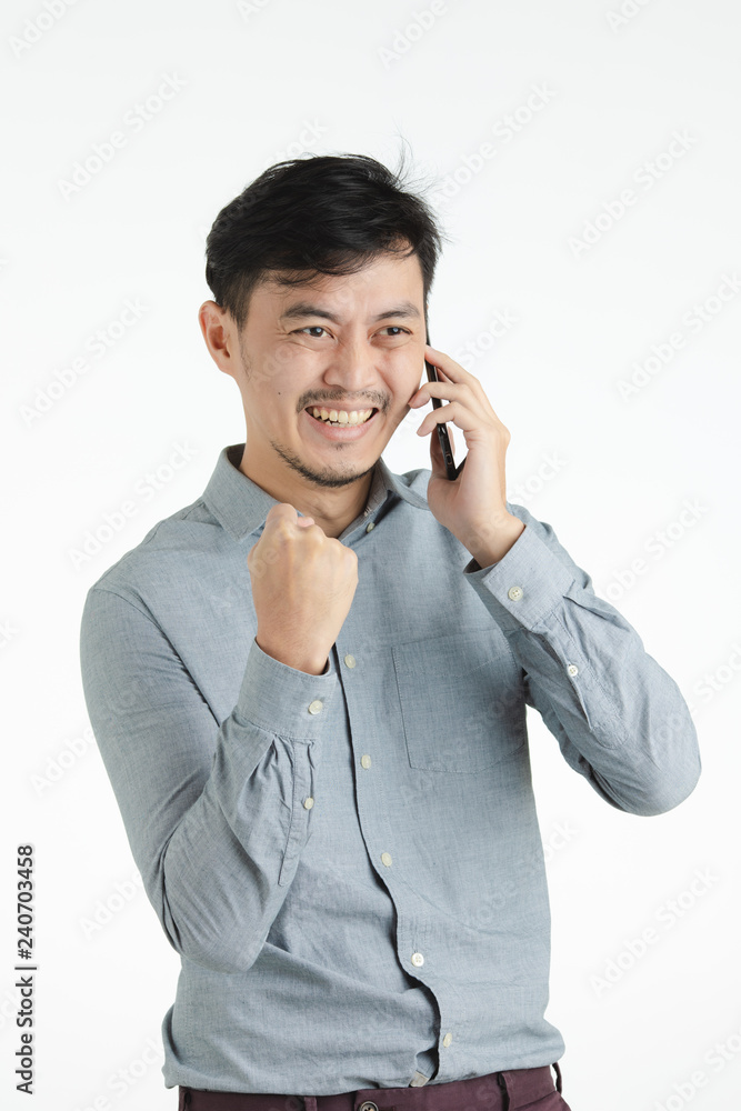 Asian young man exclaimed in success Asian young man exclaimed in success