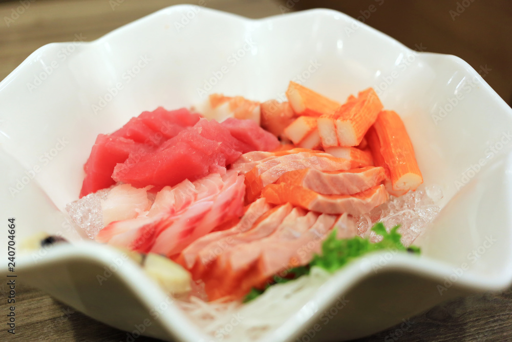 Sashimi bowl set such as salmon, mackerel, crab stick (Kanikama) and tuna delicious fresh raw fish japanese food. Sashimi bowl set such as salmon, mackerel, crab stick (Kanikama) and tuna delicious fresh raw fish japanese food.