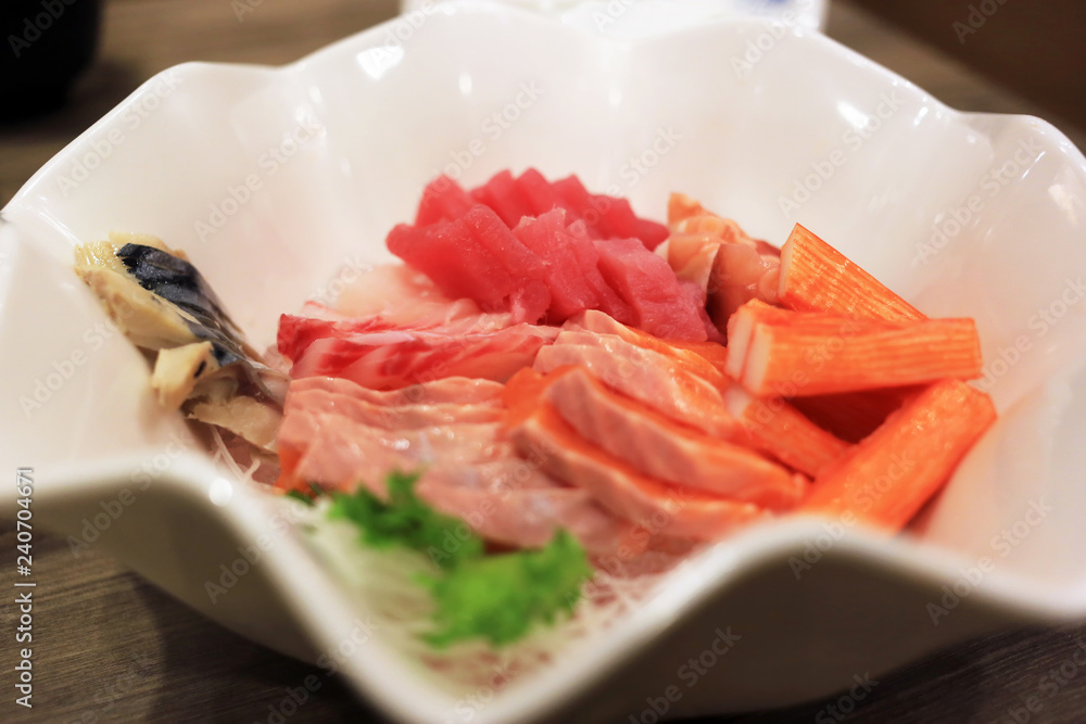 Sashimi bowl set such as salmon, mackerel, crab stick (Kanikama) and tuna delicious fresh raw fish japanese food. Sashimi bowl set such as salmon, mackerel, crab stick (Kanikama) and tuna delicious fresh raw fish japanese food.