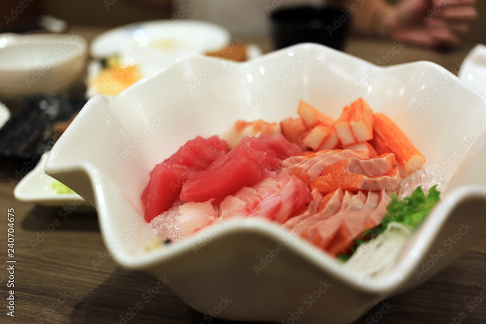 Sashimi bowl set such as salmon, mackerel, crab stick (Kanikama) and tuna delicious fresh raw fish japanese food. Sashimi bowl set such as salmon, mackerel, crab stick (Kanikama) and tuna delicious fresh raw fish japanese food.