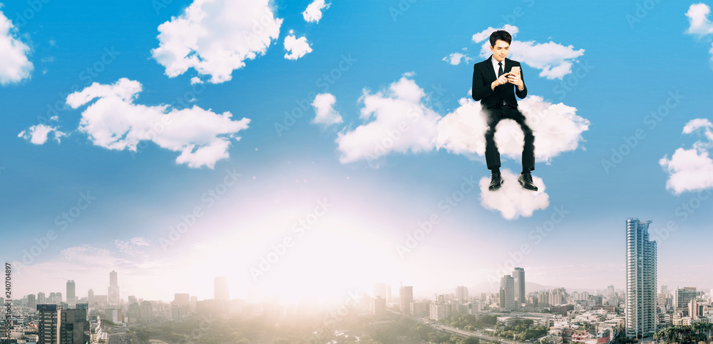businessman watching smart phone and sitting on the cloud businessman watching smart phone and sitting on the cloud