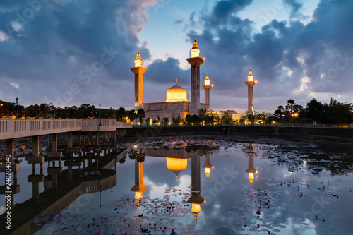 Bukit Jelutong Mosque in the morning with reflection in the lake photo