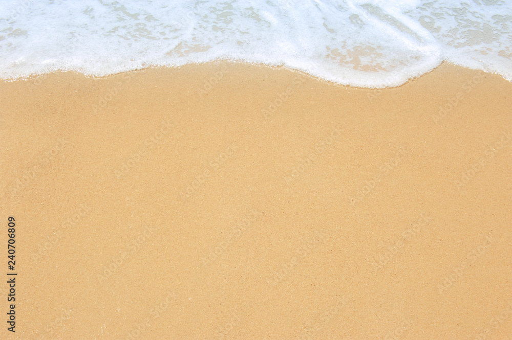 Soft ocean wave on clean sandy beach Soft ocean wave on clean sandy beach
