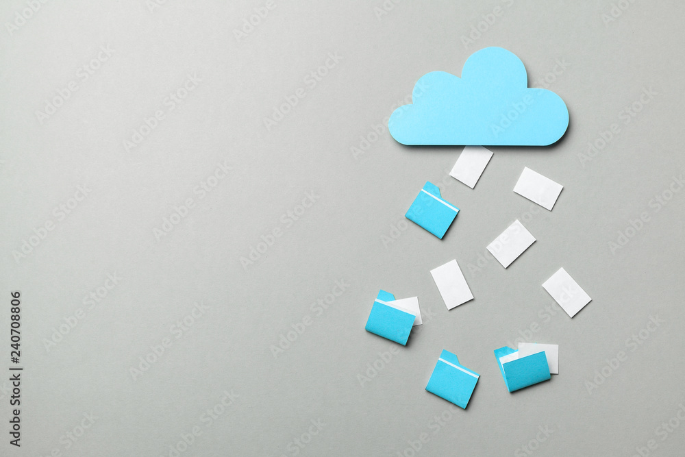 Obraz premium Cloud storage. Personal and business information and files are stored online in the cloud. Blue cloud and white files and folders on gray background. Copy space for text.