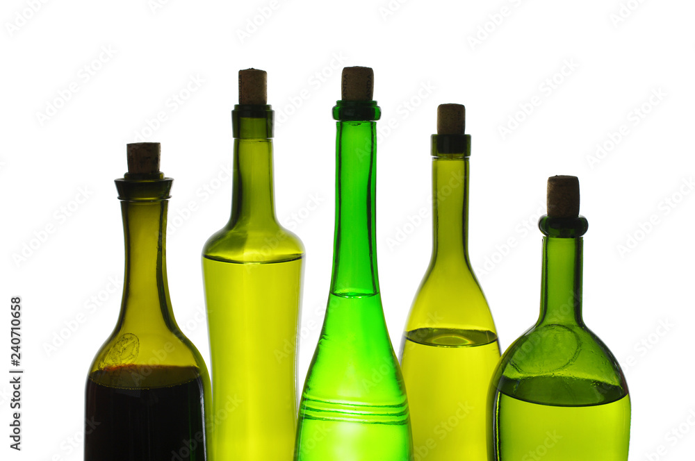 Colored wine bottles on white. Isolated on white Colored wine bottles on white. Isolated on white