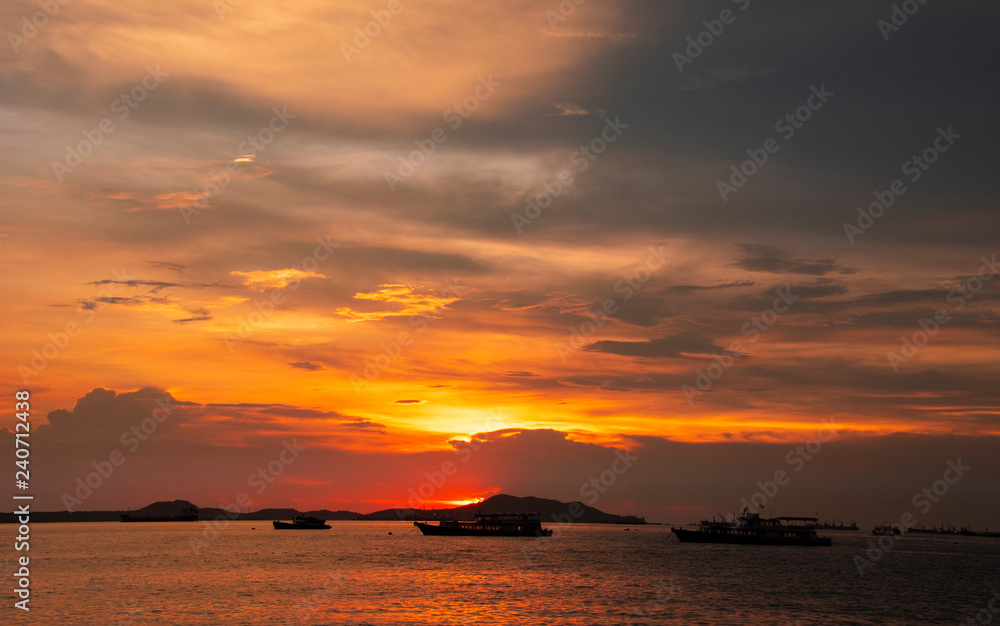 Sunset at the sea withcloud scape background