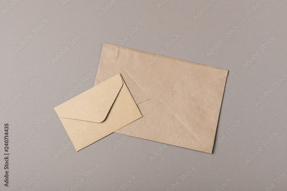 Brown craft envelopes on gray backgrounds Brown craft envelopes on gray backgrounds