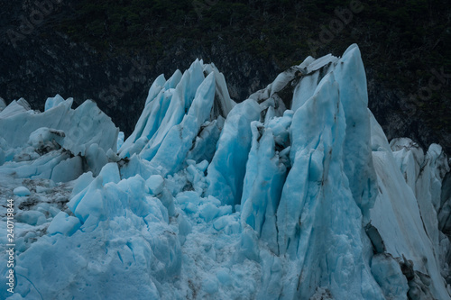 Sharp peaks of blue ice of glacier