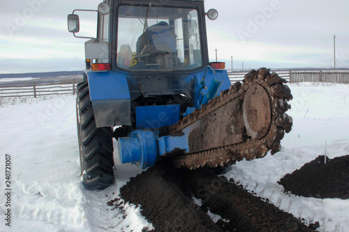 Photography Hinged cutter. Chain Trencher at work