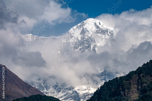 Snow Mountain Peak among Moving Clouds in the Himalayas in Nepal © FootageLab