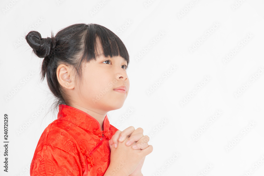 Chinese girl is happy on Chinese New Year Holiday on white background Chinese girl is happy on Chinese New Year Holiday on white background