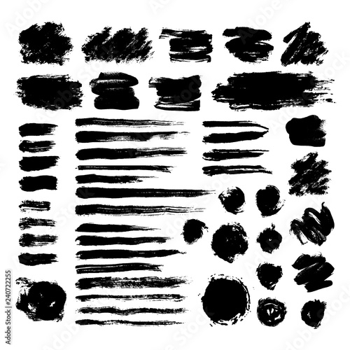 Set of black ink brush strokes isolated on white background. Hand drawn stains for backdrops. Grunge artistic brushes  text boxes  lines  splash  paintbrush collection - freehand vector illustration
