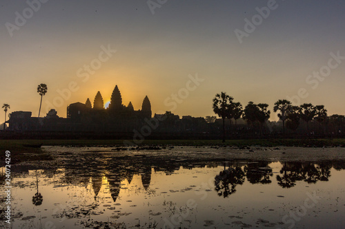 Sunrise view of ancient temple complex Angkor Wat and lake reflection, Siem Reap, Cambodia.