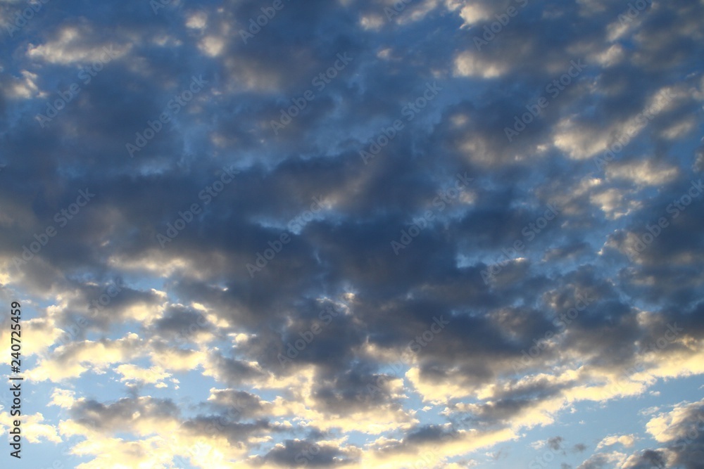 pretty colorful light clouds on the sky for using in design as background.