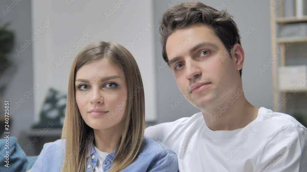 Close Up of Young Couple Looking at Camera Close Up of Young Couple Looking at Camera