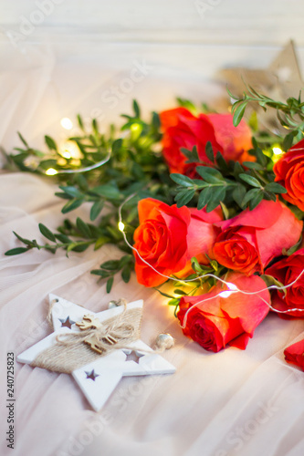 Composition  red roses with boxwood  garlands and star