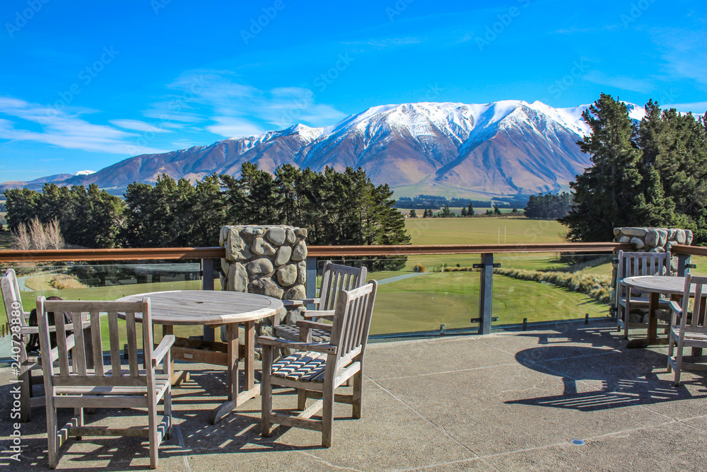 outside area of restaurant in countryside area, view over snow capped mountains, New Zealand
