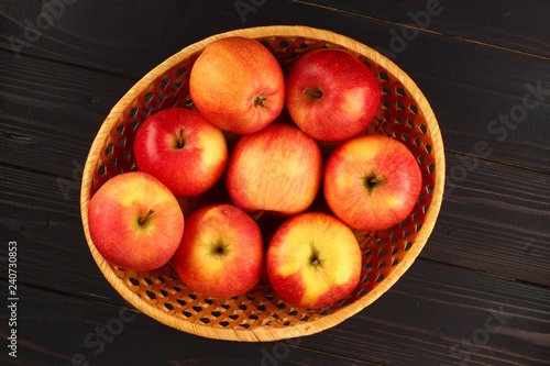 Florin apples in a basket on a dark background