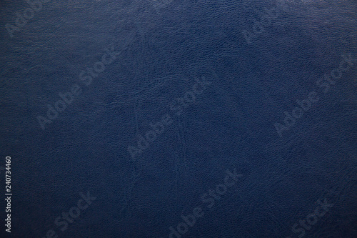 Dark blue textured leather background. Abstract leather texture.