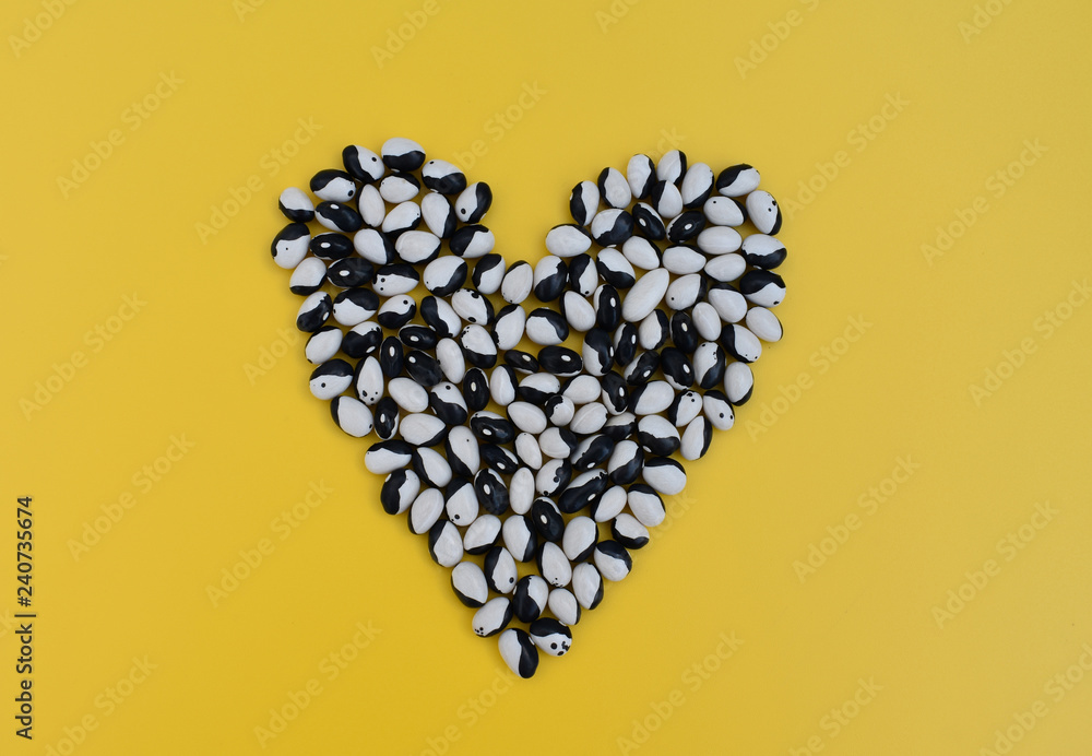Heart on yellow background.