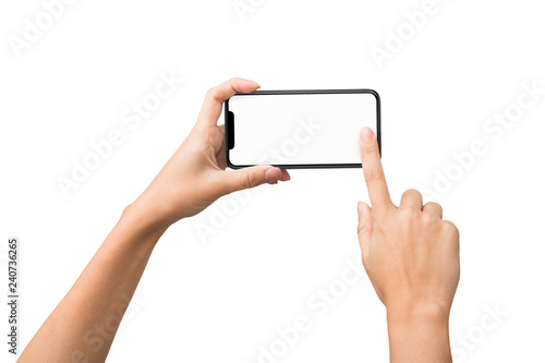 Tableau sur toile Female hands taking photo on smartphone with blank screen