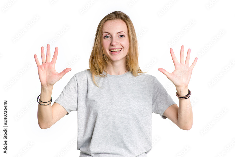 Portrait of a young happy woman showing ten fingers on two hands, isolated on white background. Portrait of a young happy woman showing ten fingers on two hands, isolated on white background.