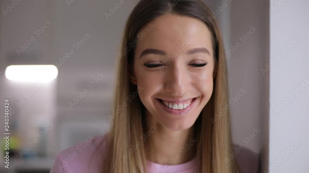 Young positive woman face smile at home in slow motion Young positive woman face smile at home in slow motion