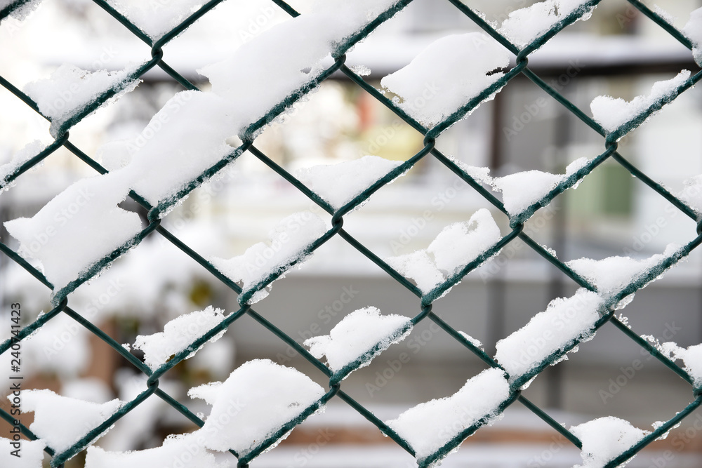 fence covered with snow on background fence covered with snow on background