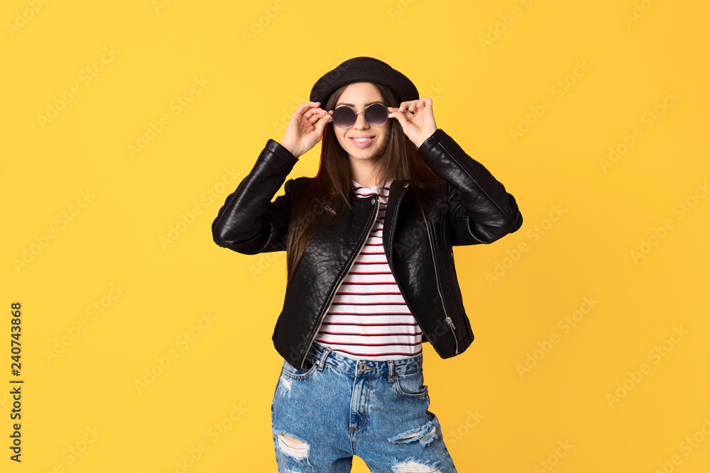 Smiling trendy girl wearing sunglasses Smiling trendy girl wearing sunglasses