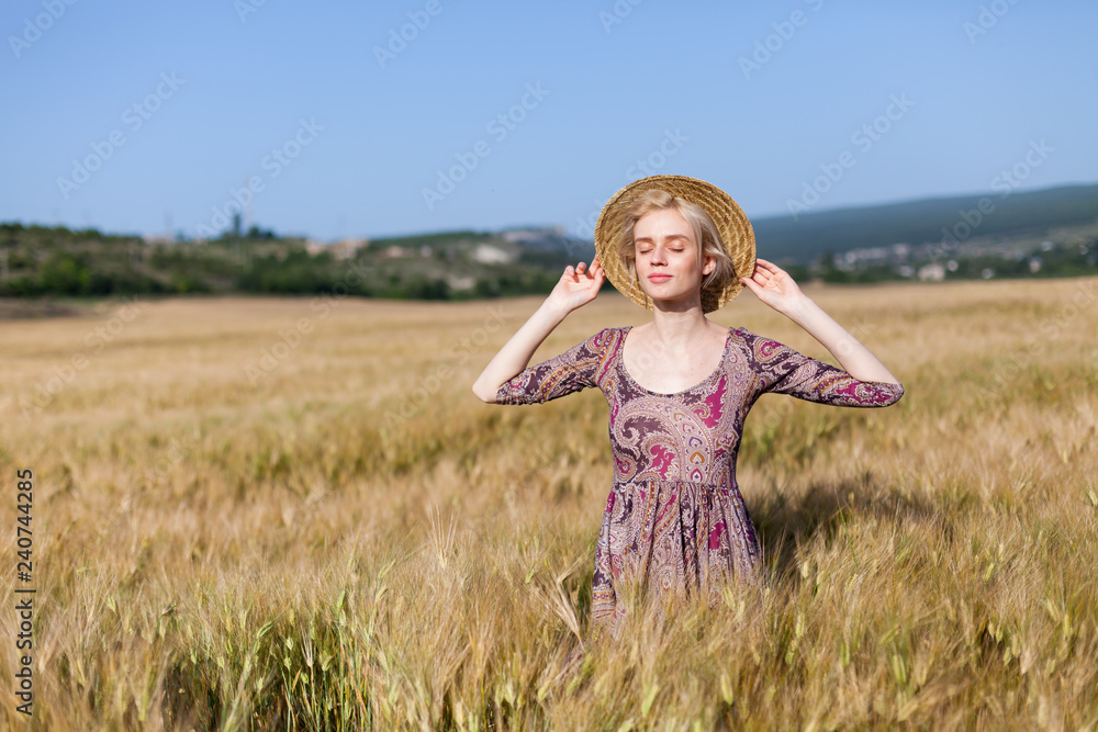 fashionable woman farmer in field of wheat harvesting rye fashionable woman farmer in field of wheat harvesting rye